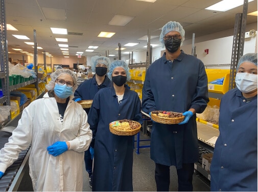 Employees packing custom trays