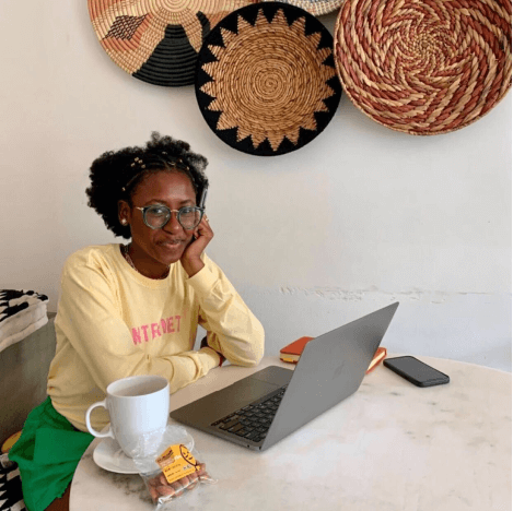 Woman in cafe with Nuts.com bag