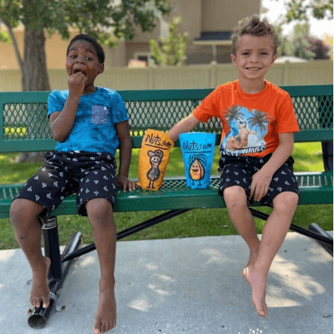 2 boys eating Nuts.com snacks