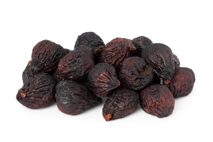 Dried figs, dried apricots and prunes in a mix with almonds in a